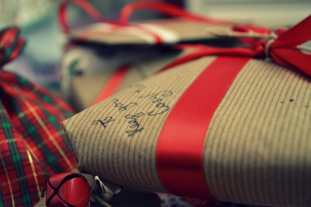 brown paper packages tied with red ribbon